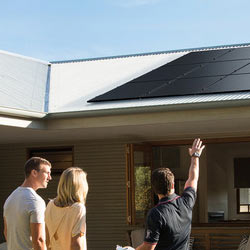 Couple getting a free in-home solar assessment from a Solahart dealer.